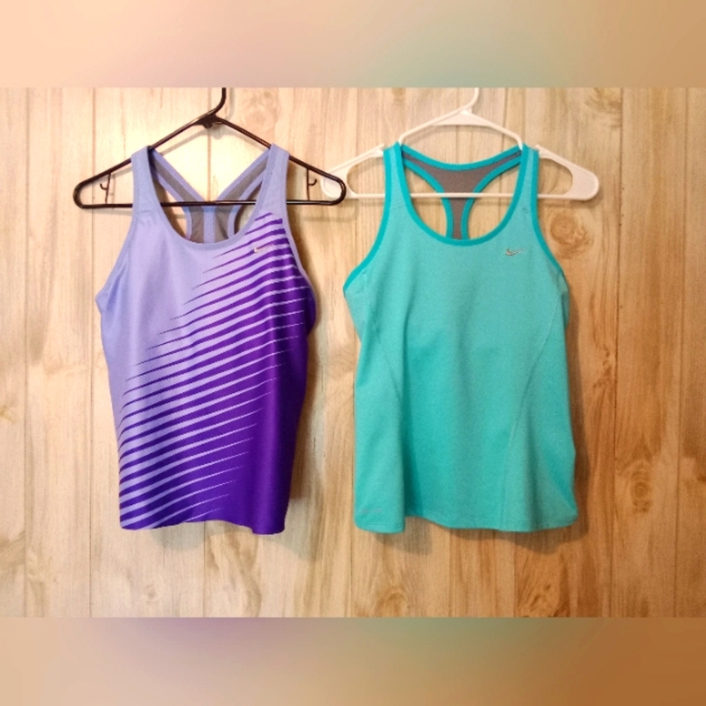 2 Nike dri-fit tank tops. Small w/ built in support bras.
